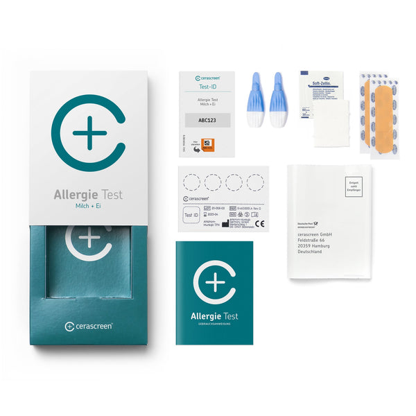 Inhalt des Milch- und Ei- Allergietestkits von cerascreen: Verpackung, Anleitung, Lanzetten, Plfaster, Trockenblutschatulle, Desinfektionstuch, Rücksendeumschlag